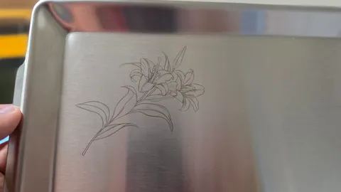 Custom engraved stainless steel serving platter featuring a detailed lily flower illustration and personalized message.