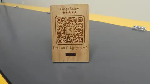 Custom laser cut wood Google Review sign with high precision etched QR code and NFC logo.
